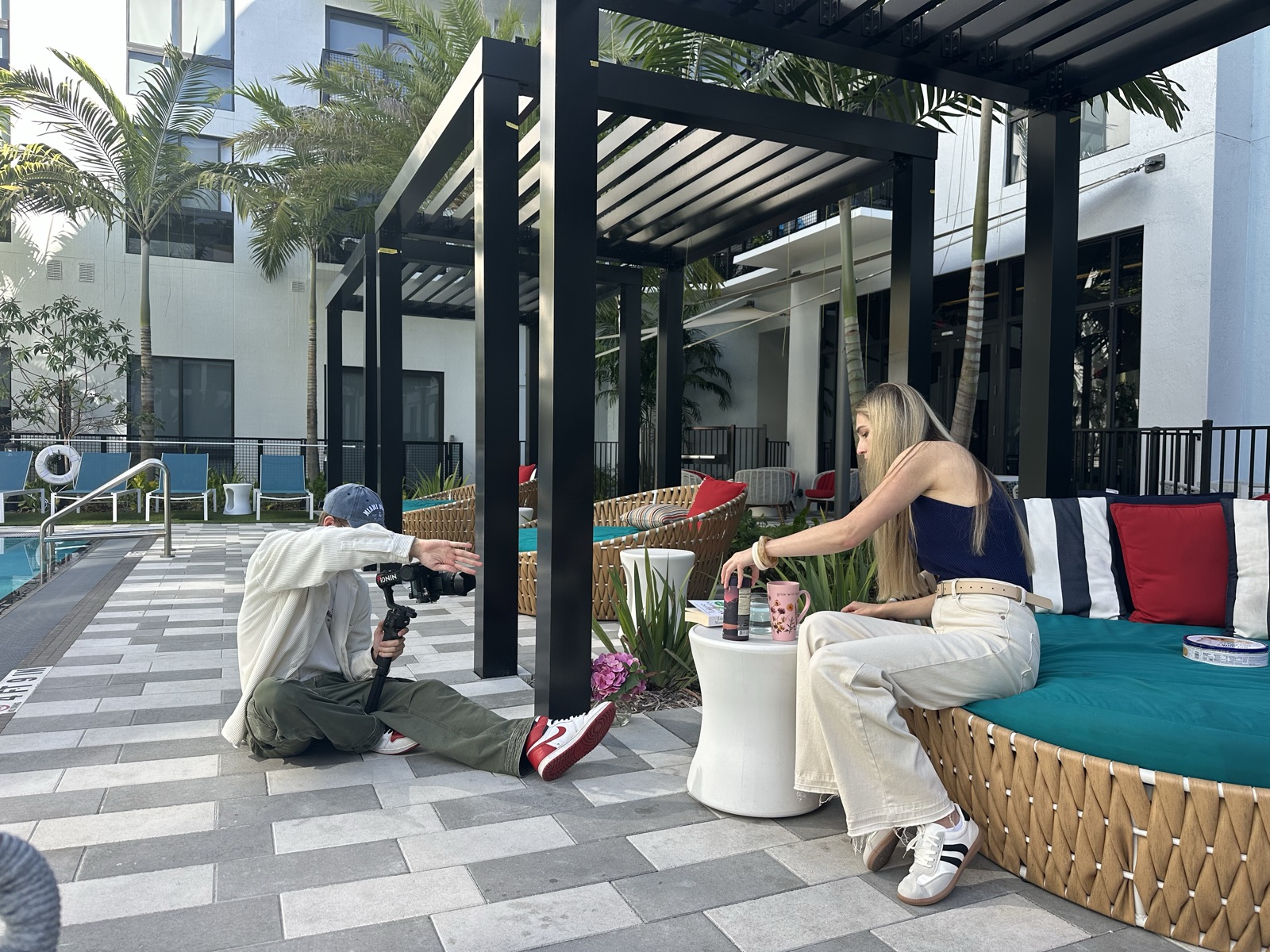 Leon Szczaurski directing a MindBlend lifestyle shoot poolside with a gimbal, Fort Lauderdale