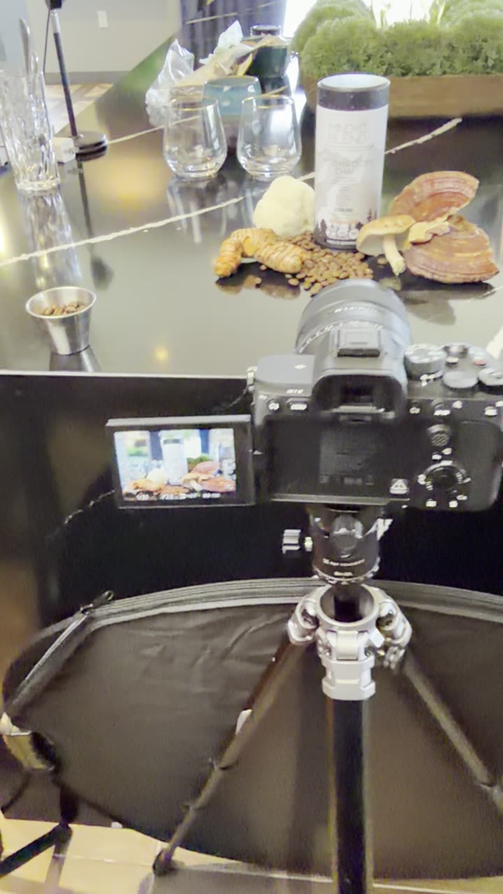 Behind the scenes on the MindBlend product shoot: the coffee tin lit on a product backdrop, framed vertically on a Sony A7 IV